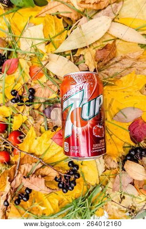 Saint-petersburg, Russia, 17102018 Drink 7up In A Glass Tin Bottle On Autumn Yellow Green Foliage Of