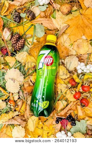 Saint-petersburg, Russia, 17102018 Drink 7up In A Glass Tin Bottle On Autumn Yellow Green Foliage Of