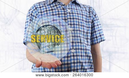 Young Man Shows A Hologram Of The Planet Earth And Text Service