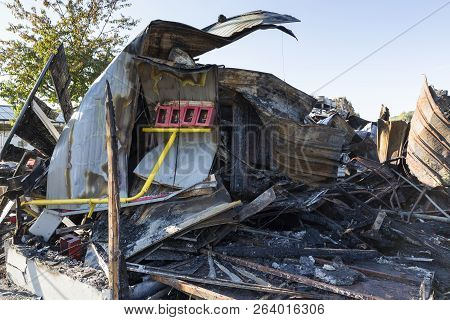 Damaged Industry Supermarket Metallic Facade After Arson Fire With Burnt Debris After Intense Burnin