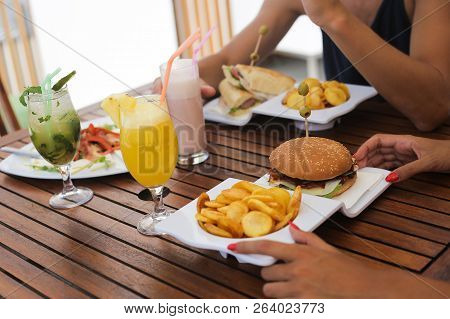 Couple Lunching And Drinking Natural Juices