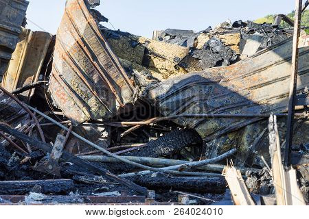 Damaged Industry Supermarket After Arson Fire With Burn Debris Of Twisted Metal Wood Structure After