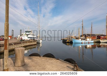 Holbaek, Denmark - October 2018: The Harbour With Ferry Terminal And Beautiful Old Sail Boats At The
