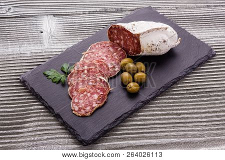 Saucisson Sec Delicious French Salami On A Wooden Background