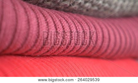 Knitten Things. Sweaters Are Lying A Pile. Close-up, Cozy Seasonal Background