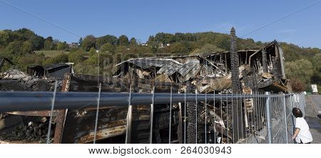 Damaged Industry Supermarket After Arson Fire With Burn Debris Of Twisted Metal Wood Structure After