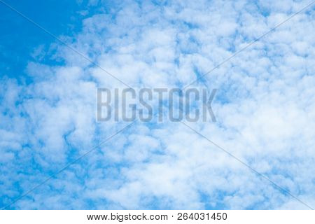 Blue Sky Background With Tiny Clouds