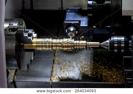 The Cnc Lathe Machine Cutting  The Groove Slot At The Steel Shaft By Milling Spindle .hi-technology 