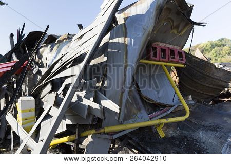 Damaged Industry Supermarket Metallic Facade After Arson Fire With Burnt Debris After Intense Burnin