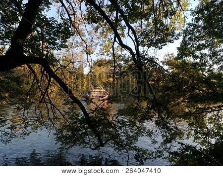 Sofiyivka Park, Time Is Nearing Evening, A Pleasure Boat Floats Across The Surface Of The Lake, Look