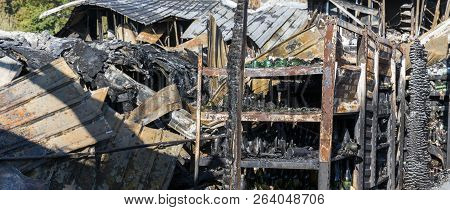 Damaged Industry Supermarket After Arson Fire With Burn Debris Of Twisted Metal Wood Structure After