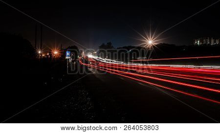 Fast Driving Vehicles Trial At Night, With Long Exposure Blurred Effect At Indian Nation Highway 19 