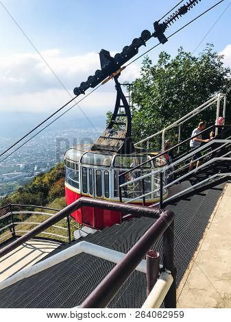 Pyatigorsk, Russia - September 17, 2018: Tourists Near Cabin Of Aerial Lift On Top Mashuk Mount In P