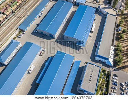 Aerial Top View Of Warehouses Hangars Near The Industrial Factory Zone