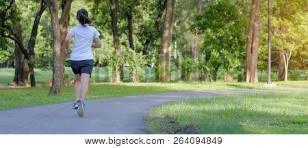 Young Fitness Woman Running In The Park Outdoor, Female Runner Walking On The Road Outside, Asian At