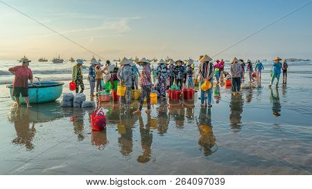 Mui Ne, Vietnam - September 28th, 2018: Fish Market Session Seas Scene People Gathered Inside Basket
