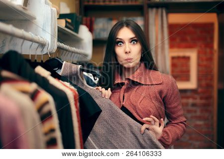 Beautiful Woman Checking Out A Cold Weather Dress In Store
