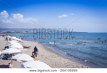 Catania, Sicily, Italy - August 15, 2018: People Relax On The Beach Lido Azzurro