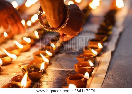 Earthen Diya Lamp Lighting With Candles On The Occasion Of Diwali And Sandhi Pujo