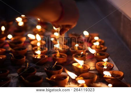 Earthen Diya Lamp Lighting With Candles On The Occasion Of Diwali And Sandhi Pujo