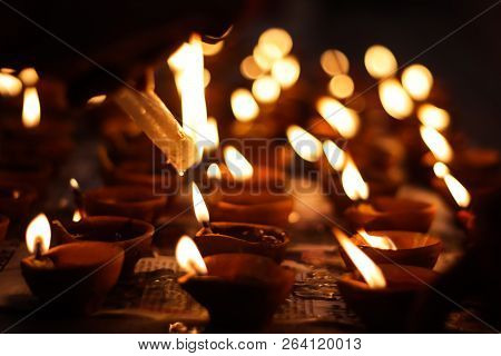 Earthen Diya Lamp Lighting With Candles On The Occasion Of Diwali And Sandhi Pujo