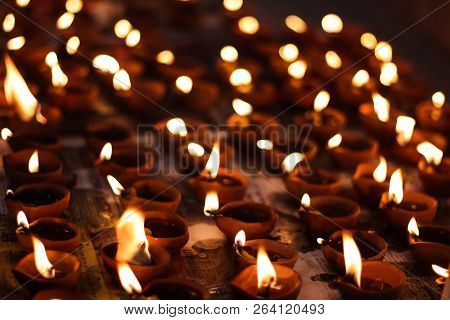 Earthen Diya Lamp Lighting With Candles On The Occasion Of Diwali And Sandhi Pujo