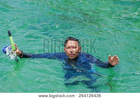 Labuan,malaysia-sept 22,2018:man Enjoying Snorkeling In Tropical Lagoon Of Rusukan Kecil Island At L