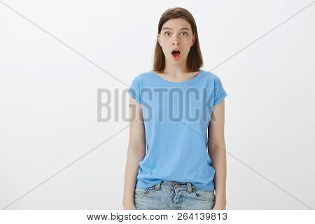 Omg, No Way It Is Real. Shocked Impressed Funny Girl In Blue T-shirt, Dropping Jaw And Staring At Ca