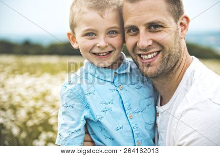 Father Spending Time With Son During The Sunset.