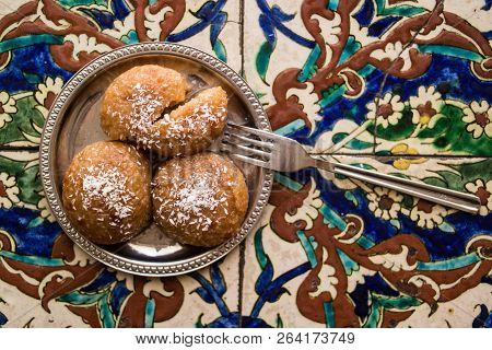Turkish Dessert Kemalpasa On A Ottoman Pattern Surface.