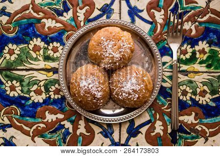 Turkish Dessert Kemalpasa On A Ottoman Pattern Surface.
