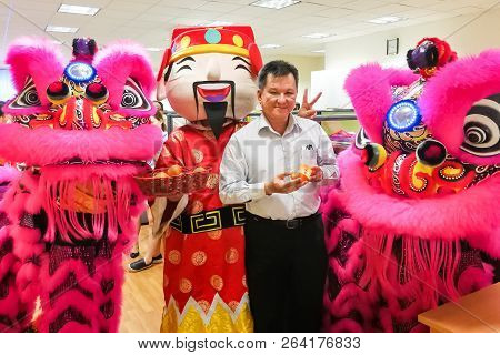 Chinese Business Manager Posing With Two Lions In Office After Dance Performance That Believe To Bri