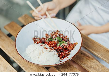 Close Up Of Chinese Food. Tsos Chicken With Rice In White Plate On The Table.