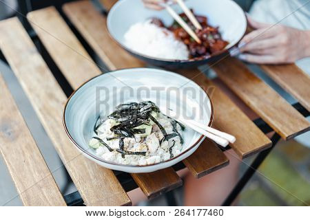 Close Up Of Chinese Food. Tsos Chicken With Rice In White Plate On The Table.