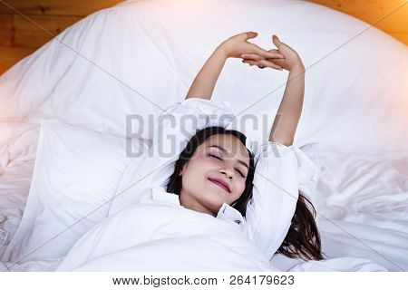 The Beautifu Laday Is Raise Hands Up In The Air,for Stretching Before Wake Up,in Morning Time,warm L