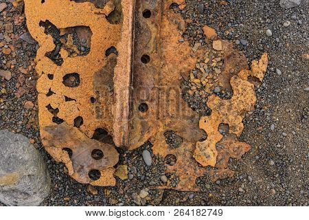 Texture Of Rusty Metal Sitting On A Rocky Beach.taken In Djupalonssandur Beach, Iceland
