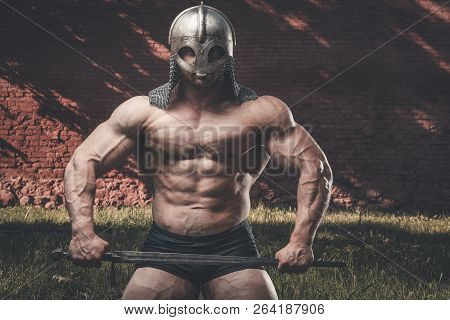 Outdoor Sport Brutal Strong Muscular Men With Sword