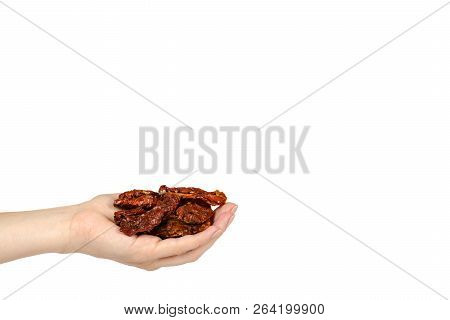 Sun Dried Red Tomatoes With Hand Isolated On White Background, Copy Space Template