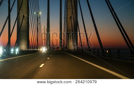 Oeresund Bridge Between Sweden And Denmark During Crossing By Car At Night
