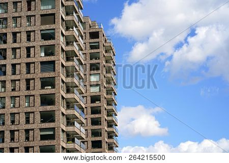 Modern Multi-storey Building On The Sky Background Balconies In The Building. Modern Apartment Build