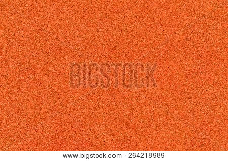 Orange Shock Absorbing Coatings Are Made From Rubber Chips That Are Used In Playgrounds, Stadiums, T