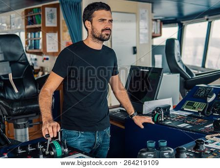 Marine Navigational Officer Is Maneuvering Ship Or Vessel
