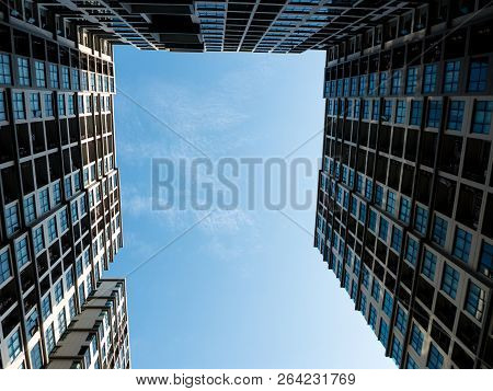 Uprisen Angle - Building In The City On Blue Sky Background