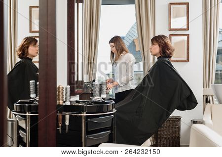 Professionsl Visagist Working With Young Woman In Beauty Salon