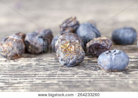 Rotten Covered With Fungus And Its Spores With Mold Blueberries Berries, Closeup On A Board