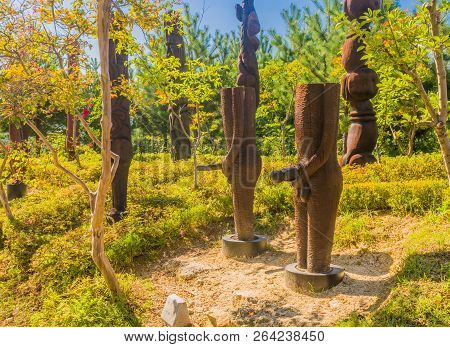 Samcheok, South Korea; September 25, 2018: Closeup Of Wooden Statues Shaped Like Human Penis In Vari