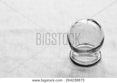 Retro. Glass Medical Jar On White Cloth.