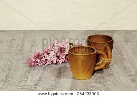 The Morning Begins With Coffee. Clay Coffee Cups With The Branch Of Lilac. Black Concrete Background