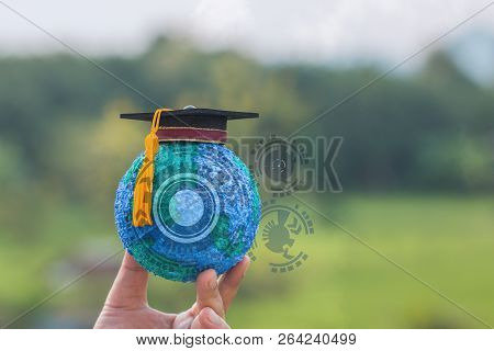 Education Study Abroad International Of School Concept: Graduation Cap On Top Earth Globe Model Map 