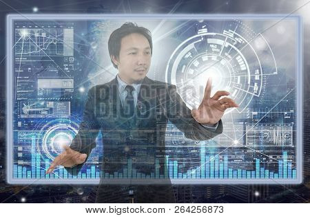 Businessman Hand Touching The Technology Digital Virtual Screen Over The Ciryscape And Trading Graph